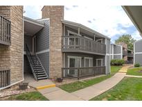 Exterior view of building with walkway and stairs at 3462 S Eagle St # 201, Aurora, CO 80014