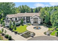 Luxury home with circular driveway and landscaped grounds at 4736 S Fillmore Ct, Cherry Hills Village, CO 80113