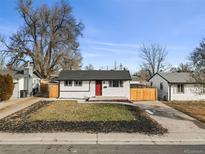 Charming updated Ranch home with a red door and fenced yard at 1882 S Alcott St, Denver, CO 80219