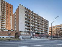 Exterior view of an apartment building with multiple floors and balconies at 4800 Hale Pkwy # 206N, Denver, CO 80220