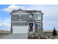 Two-story house with gray siding and white garage door at 43115 Merion Hills Ct, Elizabeth, CO 80107