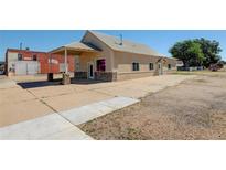 Commercial building with stone accents and covered porch at 627 Main St, Platteville, CO 80651