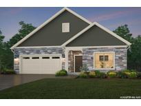 Two-story home with stone and gray siding at 303 Josef Cir, Fort Lupton, CO 80621