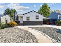 Charming Ranch home with a white and gray exterior, and rock landscaping at 46 Winona Ct, Denver, CO 80219