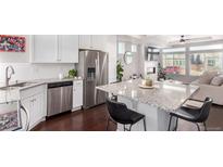 Modern kitchen with stainless steel appliances and granite countertops at 237 S Old Hammer St, Aurora, CO 80018