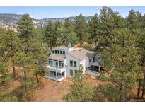 Two story home with a large deck and mountain views at 1895 Foothills S Dr, Golden, CO 80401