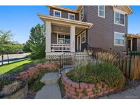 Two-story home with front porch and landscaping at 1426 Harvest Dr # 1426, Lafayette, CO 80026