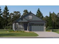 Craftsman style home with gray siding, stone accents, and a two-car garage at 5128 N Quemoy St, Aurora, CO 80019