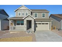 Two-story house with a stone facade and attached garage at 39153 Clymer St, Elizabeth, CO 80107