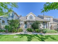 Two-story townhome with brick facade at 8016 E Fairmount Dr, Denver, CO 80230