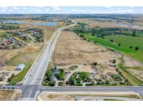 Aerial view of a property situated on a large lot near a highway at 11960 Quebec St, Brighton, CO 80602