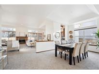 Open dining room with views into the living room and kitchen at 11144 Navajo St, Northglenn, CO 80234