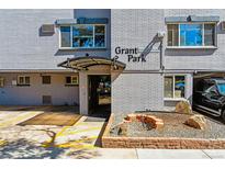 Inviting building entrance with a covered walkway and landscaping at 336 N Grant St # 409, Denver, CO 80203