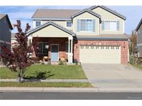 Two-story house with a brick and siding exterior at 15171 E 118Th Ave, Commerce City, CO 80603