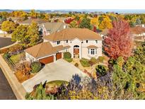 Luxury home with two-car garage and mature landscaping at 9656 E Maplewood Cir, Greenwood Village, CO 80111