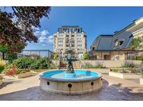 Charming courtyard with a central fountain and lush landscaping at 925 N Lincoln St # 14C, Denver, CO 80203