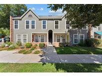 Gray multi-unit building with landscaping and walkway at 1150 Inca St # 27, Denver, CO 80204