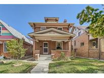 Charming two-story brick home with front porch at 980 S Pennsylvania St, Denver, CO 80209