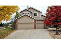 Two-story house with two car garage and landscaping at 20175 Edinborough Pl, Parker, CO 80138
