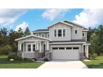 Two-story craftsman style home with gray siding, stone accents and a two-car garage at 8145 Cokedale Cir, Littleton, CO 80125