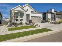 Charming farmhouse exterior with landscaped yard at 6803 Canyonpoint Rd, Castle Pines, CO 80108