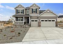 Two-story home with a two-car garage and well-maintained landscaping at 4369 Hickory Oaks St, Castle Rock, CO 80104