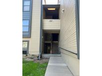 Exterior view of condo building showing stairs and walkway to unit 467 at 467 S Memphis Way # 17, Aurora, CO 80017