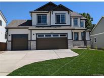 Two-story home with two-car garage and lawn at 16950 Mckay Dr, Mead, CO 80542