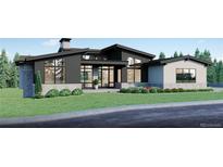 Modern two-story home with a sleek design and landscaped yard at 6188 Oxford Peak Ln, Castle Rock, CO 80108