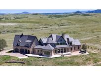 Luxury estate home with expansive grounds and mountain views at 7755 Moore Rd, Littleton, CO 80125