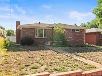 Brick ranch house with a landscaped yard and walkway at 350 S Jasmine St, Denver, CO 80224