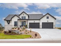 Modern farmhouse exterior with stone accents and landscaping at 5300 Soledad Cir, Parker, CO 80134