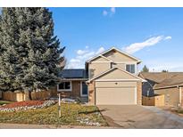 Beautiful two-story home with solar panels and landscaped yard at 11753 W Powers Ave, Littleton, CO 80127