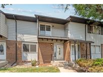 Brick townhouse with a balcony and landscaping at 3061 W 92Nd Ave # 5C, Westminster, CO 80031