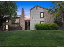 Two-story condo building exterior at dusk at 7740 W 87Th Dr # A, Arvada, CO 80005