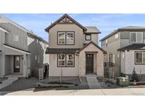 Modern two-story home with stone and siding accents at 7306 Watercress Dr, Littleton, CO 80125