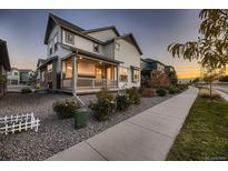 Two story house exterior with front porch and landscaping at 9307 Inca Dove Cir, Littleton, CO 80125