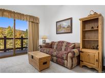 Living room with mountain views and comfy seating at 34 Highfield Trl # 315, Breckenridge, CO 80424