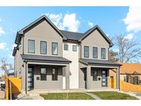 Contemporary duplex boasting gray exterior, attached garages, and well-manicured lawns at 2901 W 4Th Ave, Denver, CO 80219