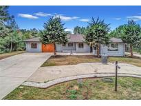 Newly renovated Ranch home with modern finishes and a spacious front yard at 9840 W 36Th Ave, Wheat Ridge, CO 80033