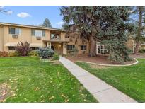 Front view of a two-story building with landscaping at 675 S Clinton St # 11A, Denver, CO 80247