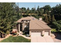 Aerial view of a two-story house with a three-car garage at 1925 S Routt Ct, Denver, CO 80227