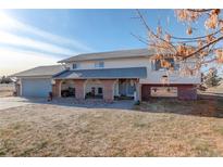 Ranch style home with brick accents and attached two-car garage at 3601 Sunrise Ln, Brighton, CO 80603