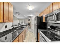 Kitchen with granite countertops and stainless steel appliances at 8653 E Dry Creek Rd # 1126, Englewood, CO 80112