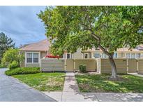 Townhouse exterior with a private fenced patio at 7370 E Florida Ave # 1020, Denver, CO 80231