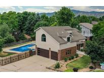 Two-story home with a pool, large yard, and mountain views at 8160 W Phillips W Ave, Littleton, CO 80128