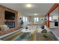 Living room with brick fireplace, dining area and kitchen at 2039 Crestvue Cir, Golden, CO 80401