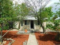House with a red mulch front yard and walkway at 1272 N Ulster St, Denver, CO 80220