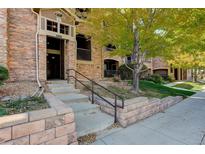 Exterior view of building showing entrance and landscaping at 2800 Blue Sky Cir # 2-206, Erie, CO 80516