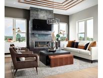 Spacious living room with a fireplace, large windows, and stylish furniture at 2329 Lakeshore Ln # 14, Superior, CO 80027